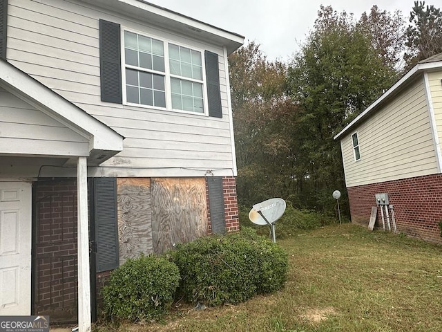 view of property exterior with a yard