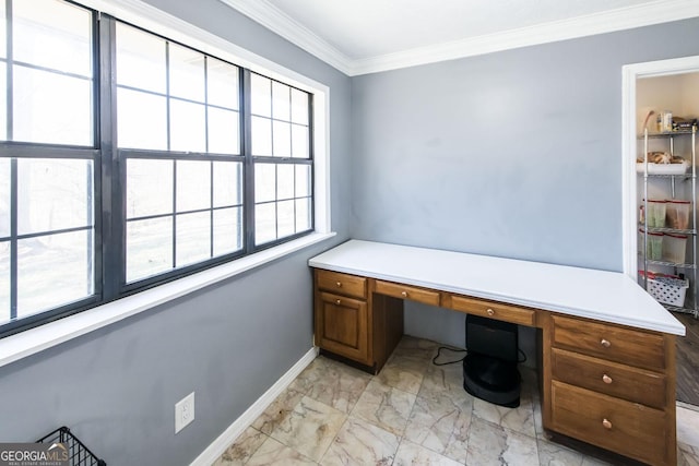 home office with built in desk and crown molding