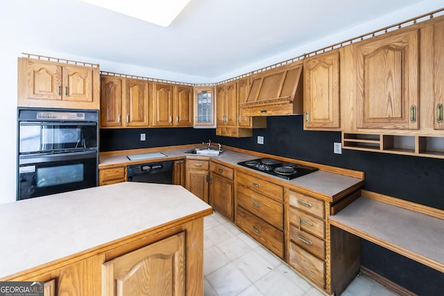 kitchen featuring sink, black appliances, and custom exhaust hood