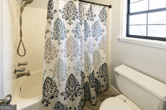 bathroom with toilet and shower / tub combo