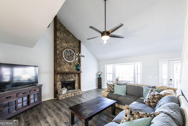 living room with high vaulted ceiling, ceiling fan, dark hardwood / wood-style floors, and a stone fireplace