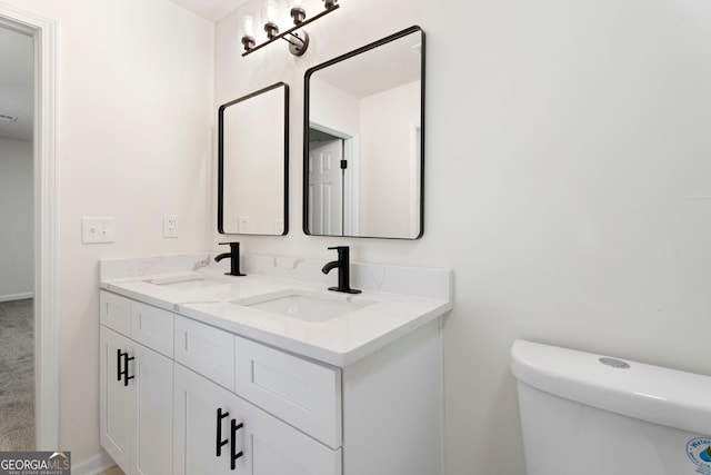 bathroom with vanity and toilet