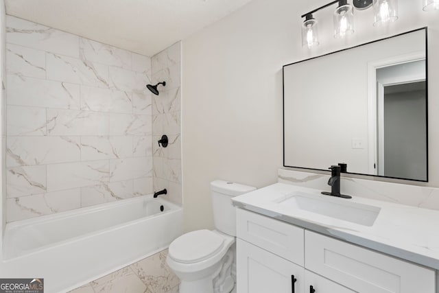 full bathroom with toilet, vanity, and tiled shower / bath