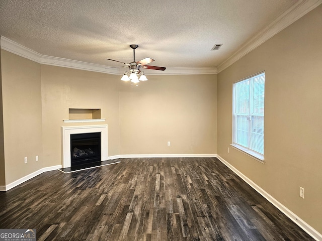 unfurnished living room with a textured ceiling, dark hardwood / wood-style flooring, ceiling fan, and crown molding