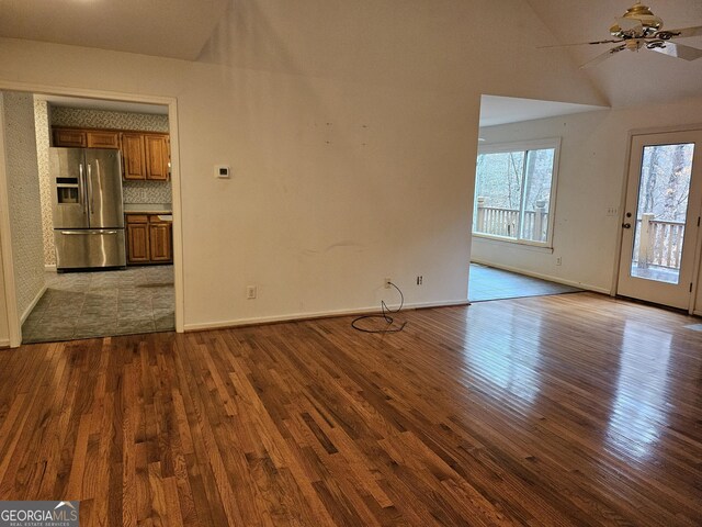 unfurnished living room featuring ceiling fan and light wood-type flooring