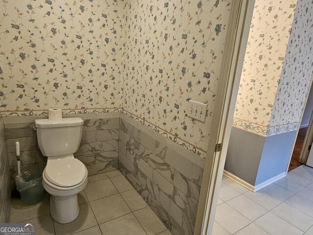 bathroom with tile patterned flooring and toilet