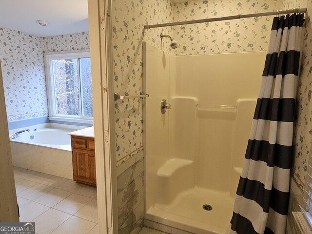 bathroom featuring separate shower and tub, tile patterned floors, and vanity