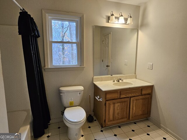 full bathroom featuring vanity, toilet, and shower / bathtub combination with curtain