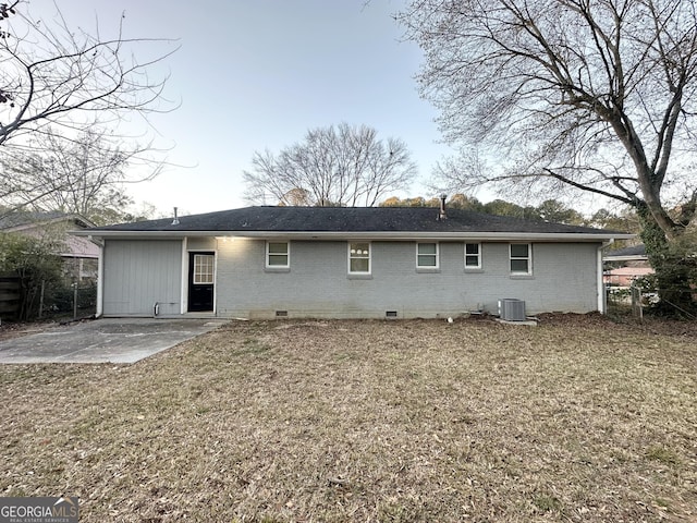 rear view of property featuring central AC unit and a patio area