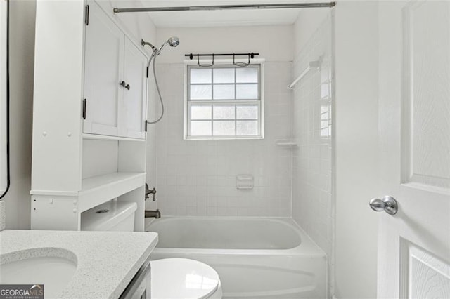 full bathroom with vanity, toilet, and tiled shower / bath