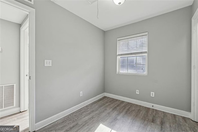 spare room featuring light hardwood / wood-style floors