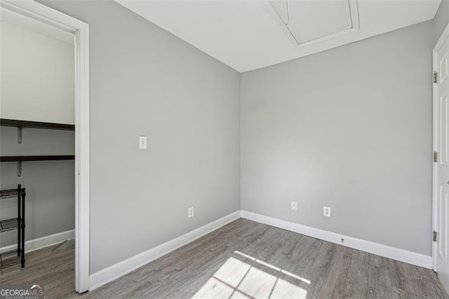 empty room with wood-type flooring