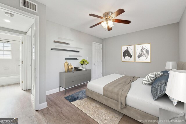 bedroom with ceiling fan and wood-type flooring