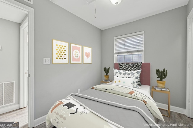 bedroom featuring wood-type flooring