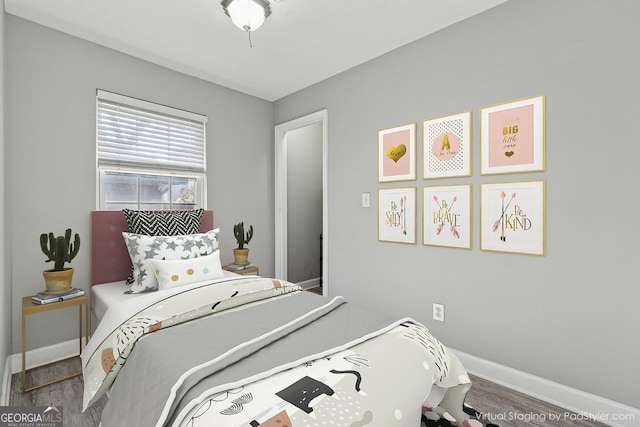 bedroom featuring hardwood / wood-style flooring