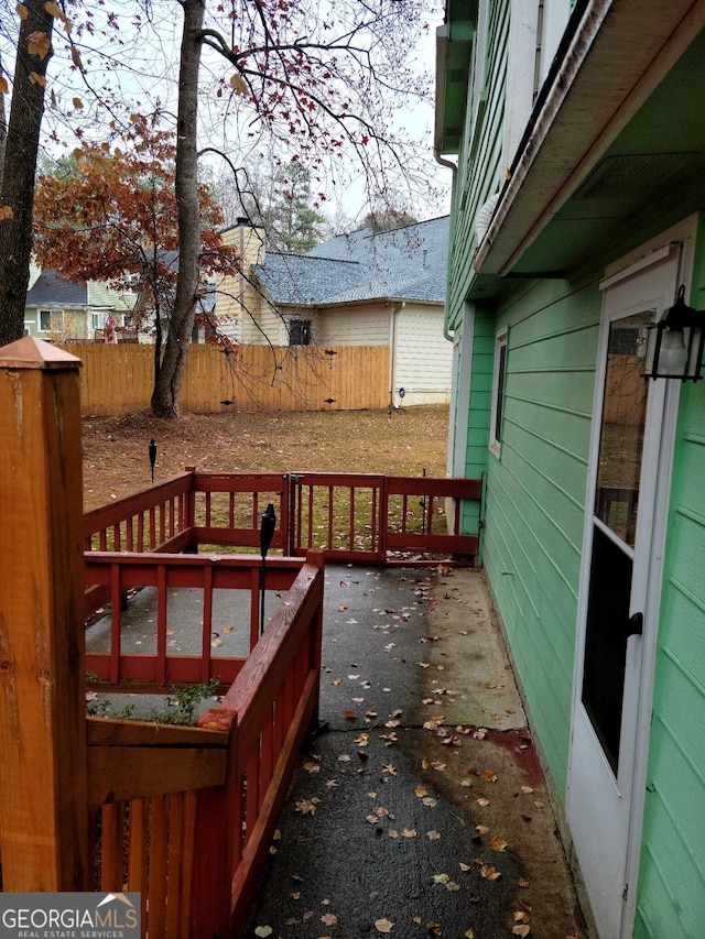 wooden deck with a patio area