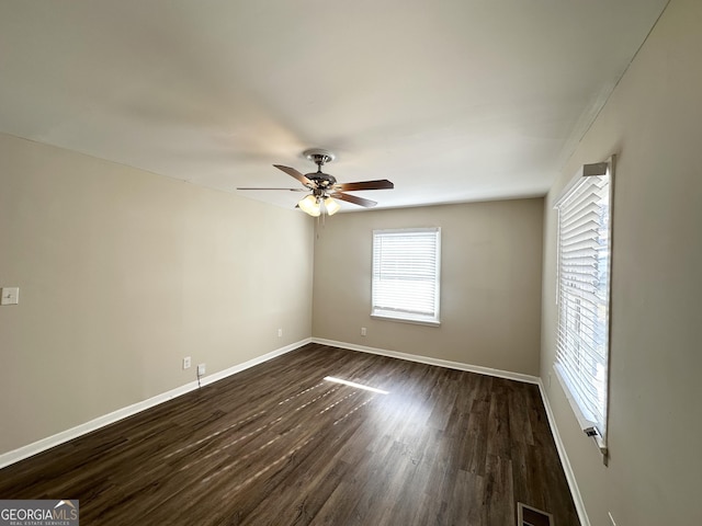 unfurnished room with ceiling fan and dark hardwood / wood-style floors