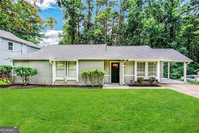 ranch-style home with a front yard and a carport