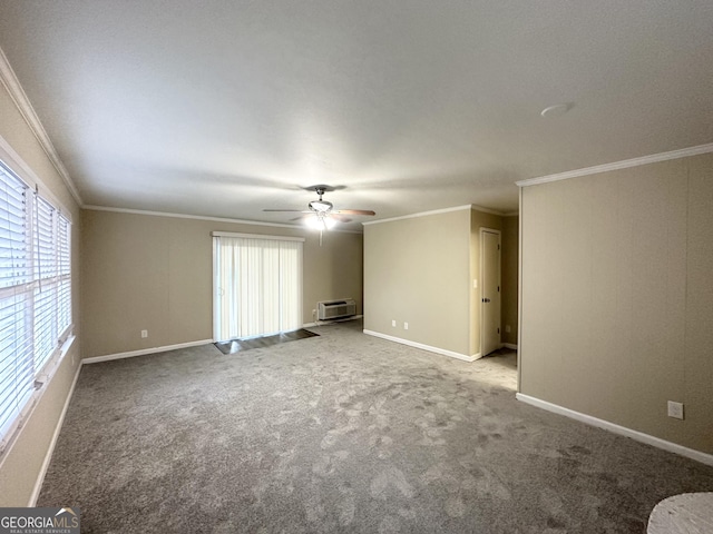 carpeted spare room featuring a wall mounted air conditioner, ceiling fan, and crown molding