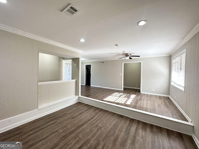 unfurnished room with dark hardwood / wood-style floors and ornamental molding