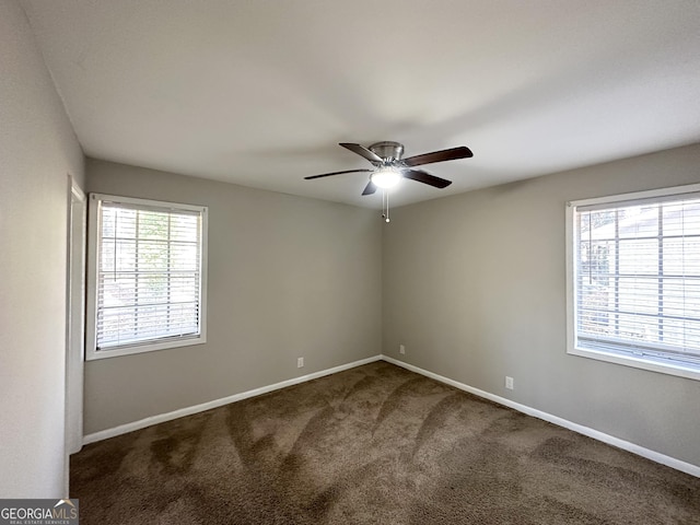 empty room featuring carpet and ceiling fan