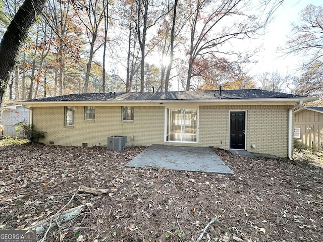 rear view of house with a patio and cooling unit