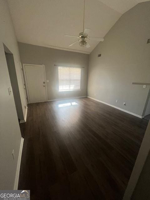 unfurnished living room with ceiling fan, dark hardwood / wood-style flooring, and vaulted ceiling