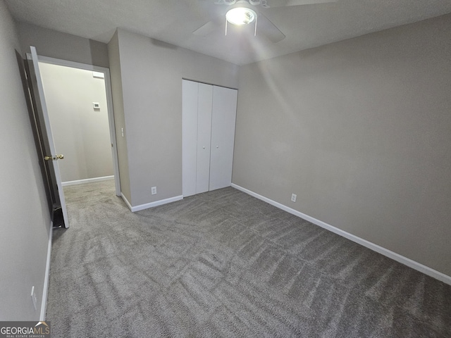 unfurnished bedroom with light carpet, a closet, and ceiling fan