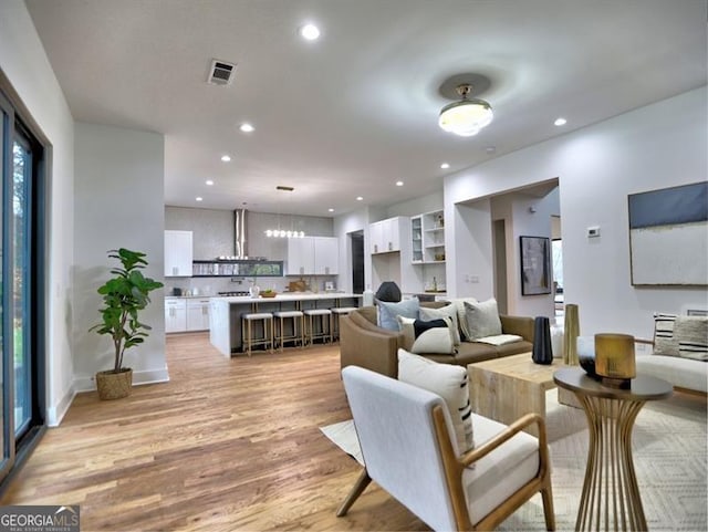 living room with light hardwood / wood-style floors