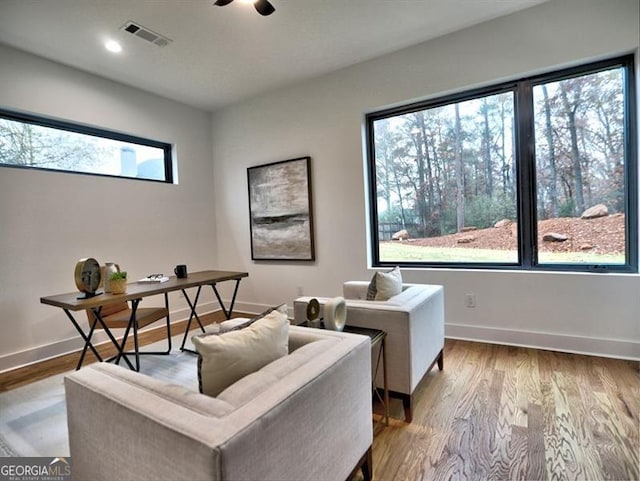 interior space featuring hardwood / wood-style floors and ceiling fan