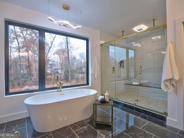 bathroom featuring separate shower and tub