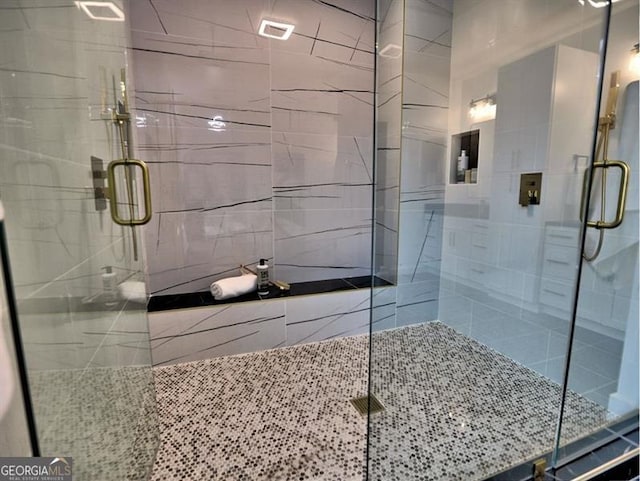 bathroom with tile walls and an enclosed shower