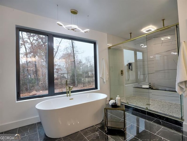 bathroom with shower with separate bathtub