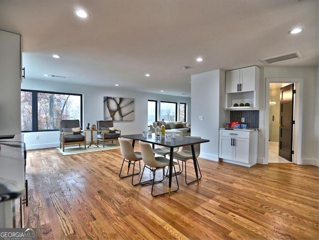 dining room with light hardwood / wood-style flooring