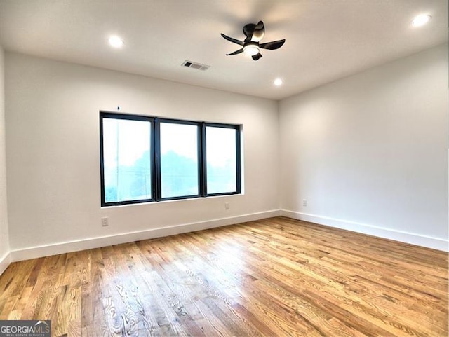 unfurnished room with ceiling fan and light hardwood / wood-style flooring