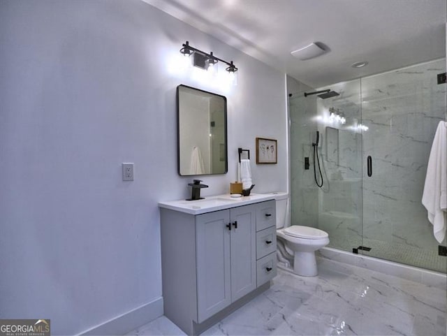 bathroom featuring vanity, toilet, and an enclosed shower