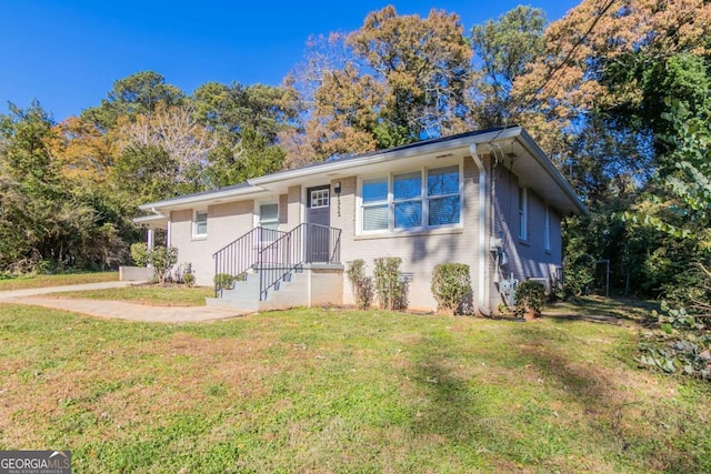 view of front of home with a front yard