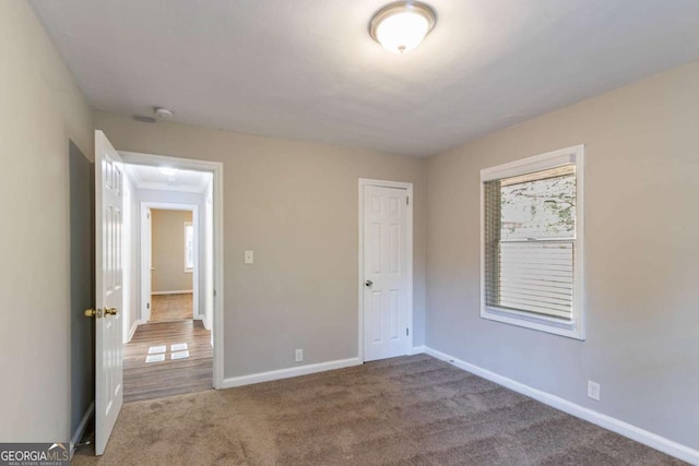 unfurnished bedroom featuring carpet