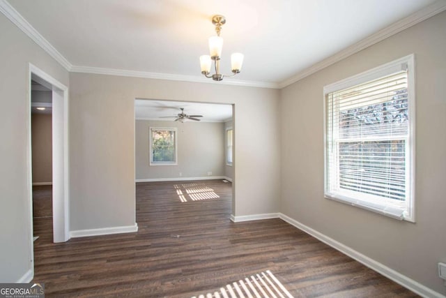 unfurnished dining area featuring an inviting chandelier, a wealth of natural light, dark wood-type flooring, and crown molding