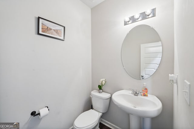 bathroom with sink and toilet