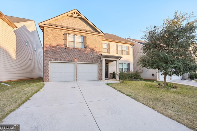 view of front of house with a front yard and a garage