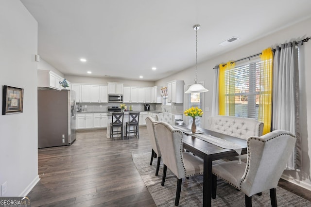 dining area with dark wood-type flooring