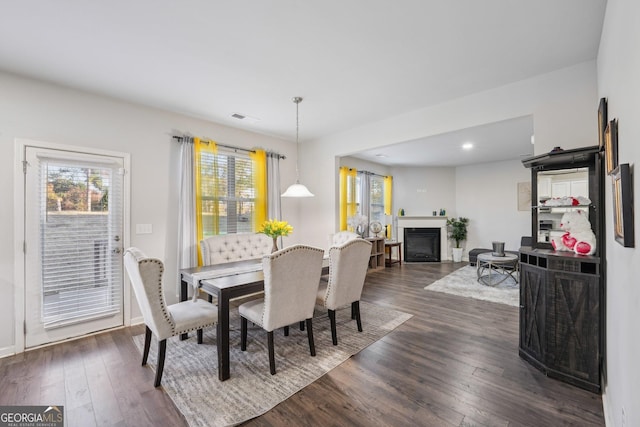 dining area with dark wood-type flooring