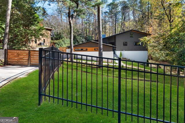 view of gate featuring a yard