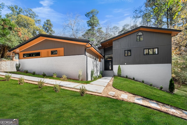 modern home with a front lawn