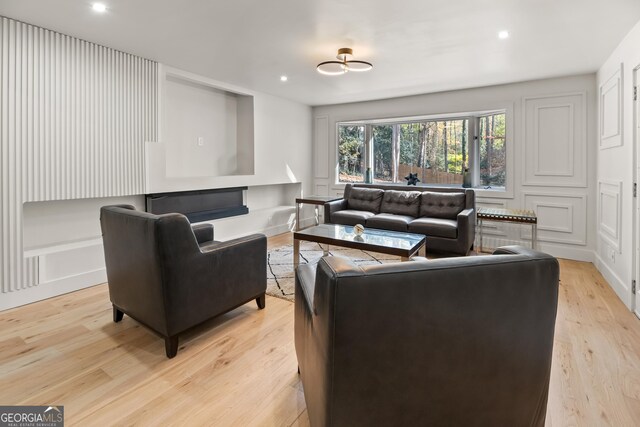 living room with light hardwood / wood-style flooring