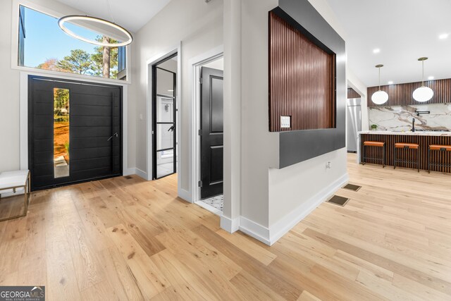 entrance foyer featuring light wood-type flooring