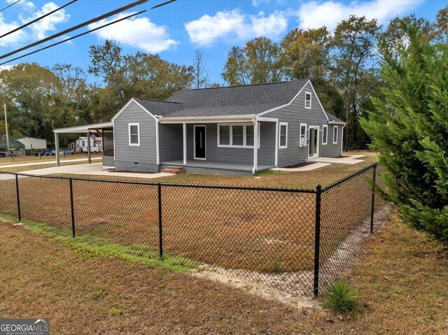 view of front of home featuring a carport