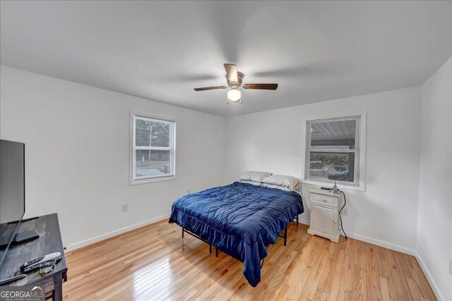 bedroom featuring light wood-type flooring and ceiling fan