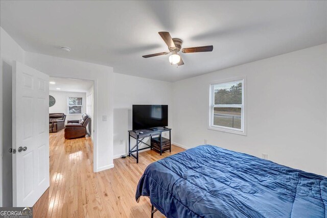 bedroom featuring hardwood / wood-style flooring and ceiling fan